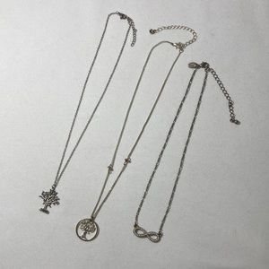 Three (3) fun necklaces. Two (2) tree necklaces and one (1) infinity necklace.